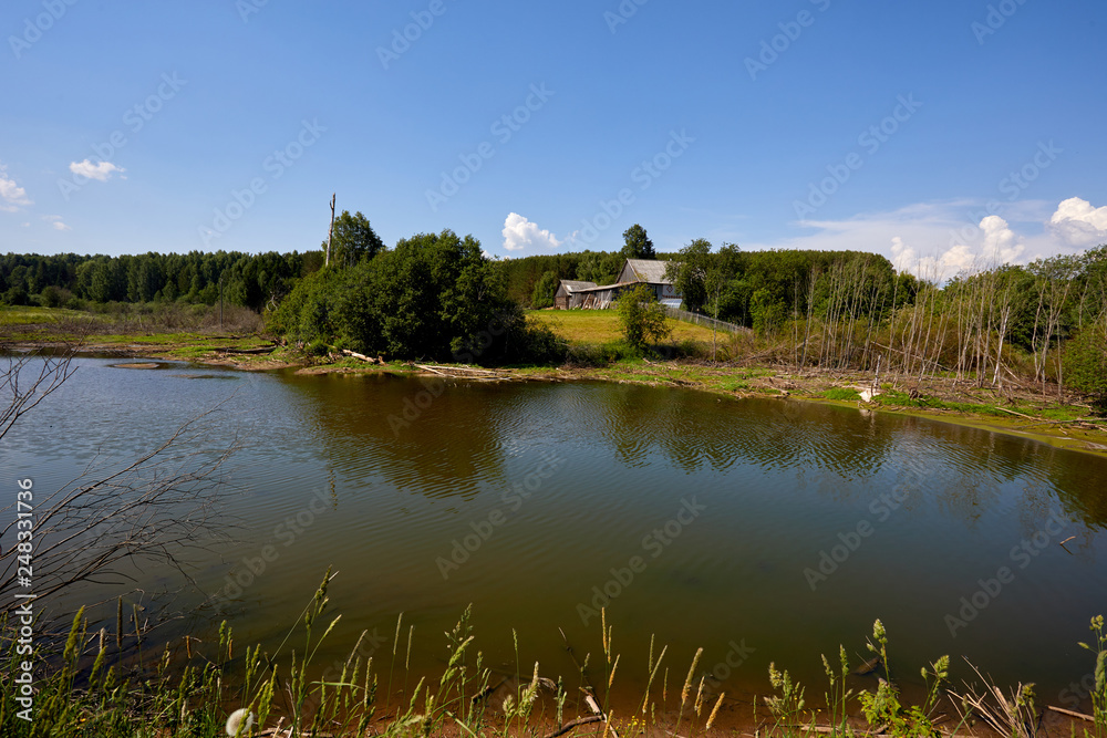 Russia. View of the village. Summer rural landscape with houses