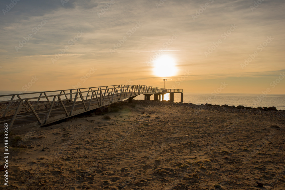 Walkway to the lookout on chilches beach at sunrise