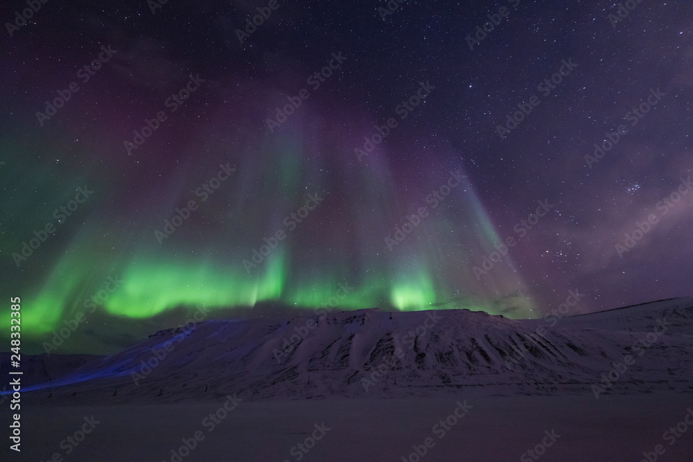 The polar arctic Northern lights aurora borealis sky star in Norway travel Svalbard in Longyearbyen city the moon mountains The polar arctic Northern lights aurora borealis sky star in Norway travel Svalbard in Longyearbyen city the moon mountains