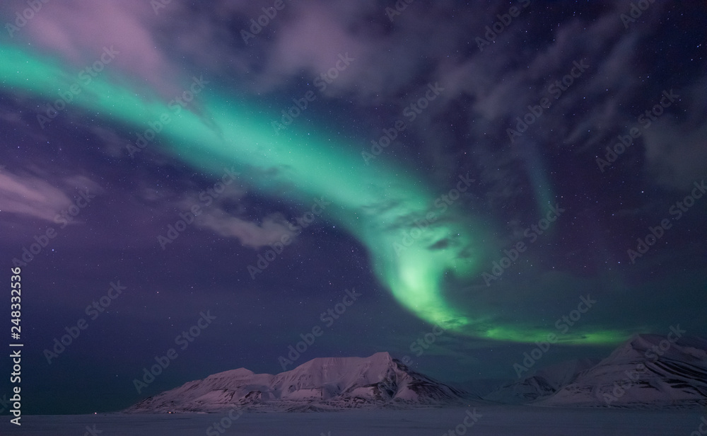 The polar arctic Northern lights aurora borealis sky star in Norway travel Svalbard in Longyearbyen city the moon mountains