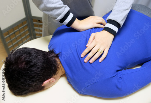 Physical therapist produces a manual effect on the client