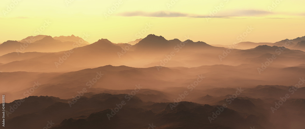 Mountains in mist at sunrise.