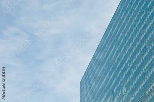 Blue sky and futuristic modern corporate office building