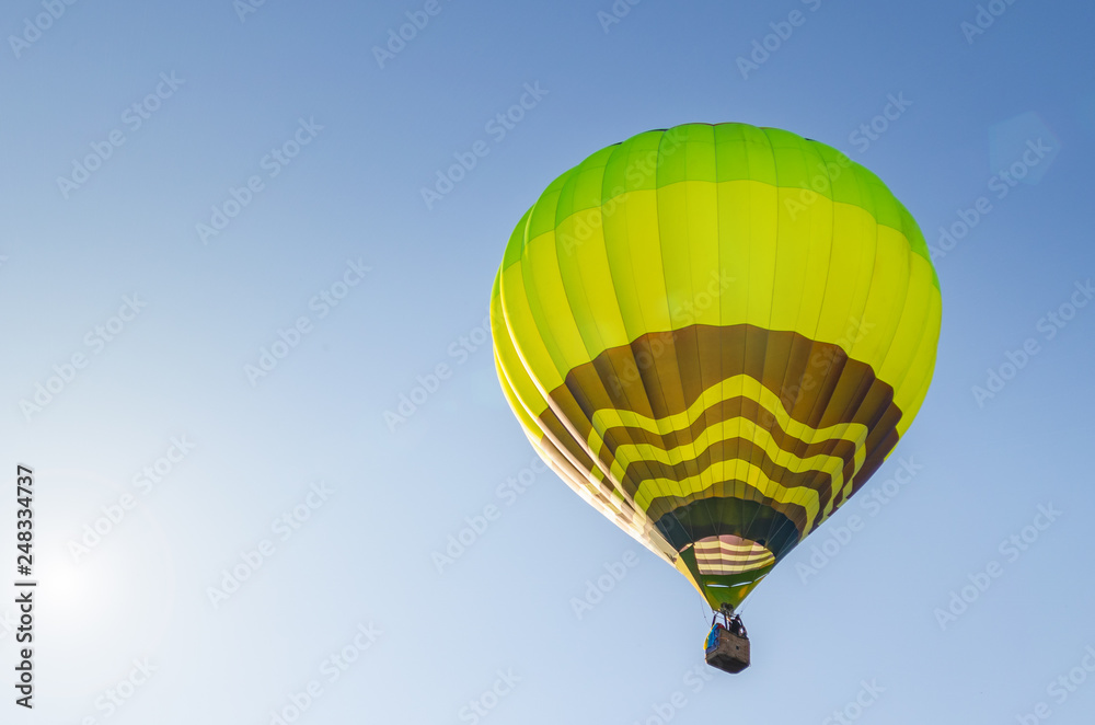 Fototapeta premium Colorful hot air balloon against the blue sky