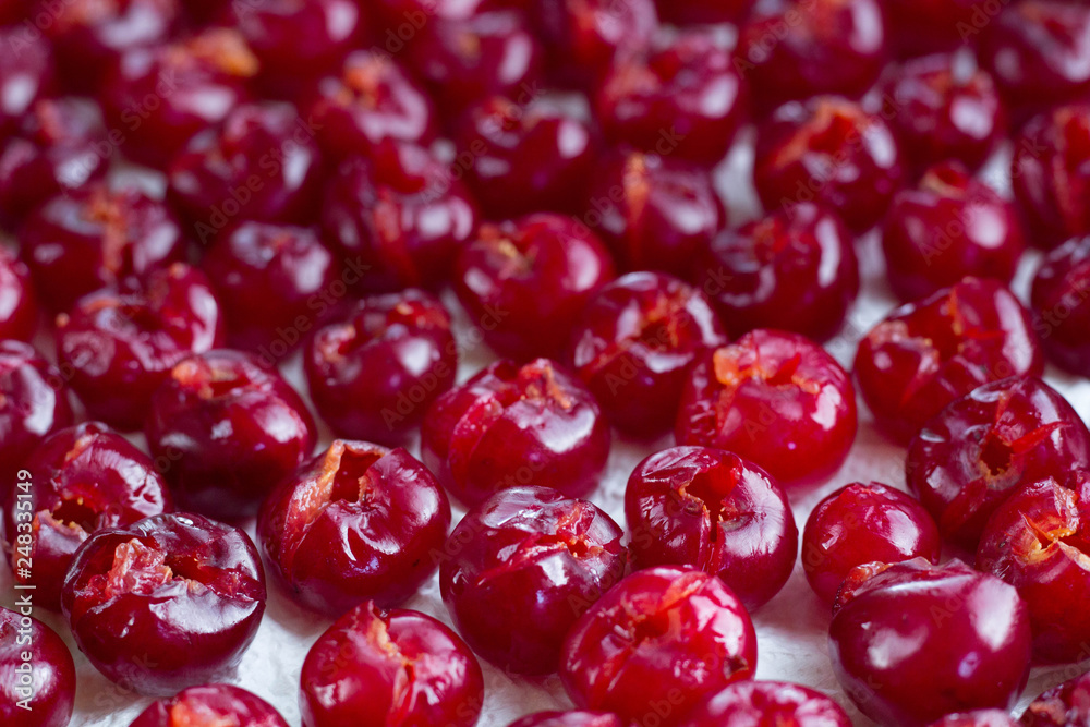 Background of fresh mellow cherries prepared for sun drying Background of fresh mellow cherries prepared for sun drying