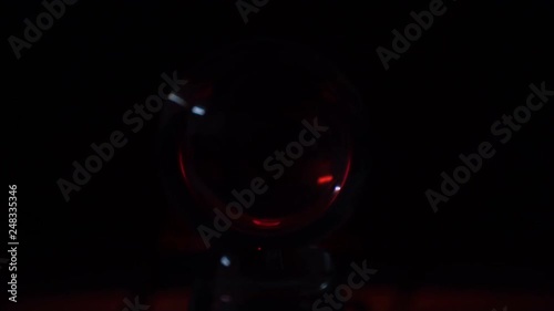 Closeup shot of red flashing light inside a crystal ball