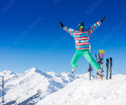 Man skier jumping and having fun in the winter ski resort.