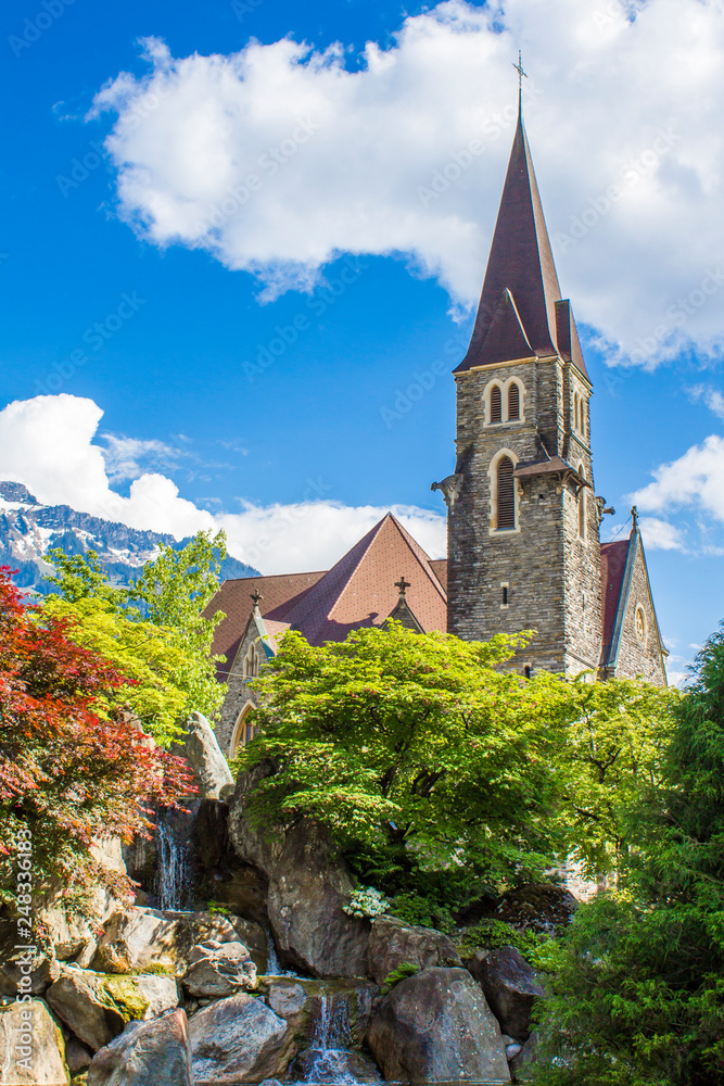 Japanese Garden of Friendship in Interlaken. View of the Church of the Holy Spirit