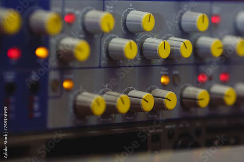 Close-up, volume control of vintage audio mixing deck