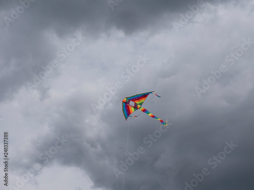 Multicolored kite soaring in the sky
