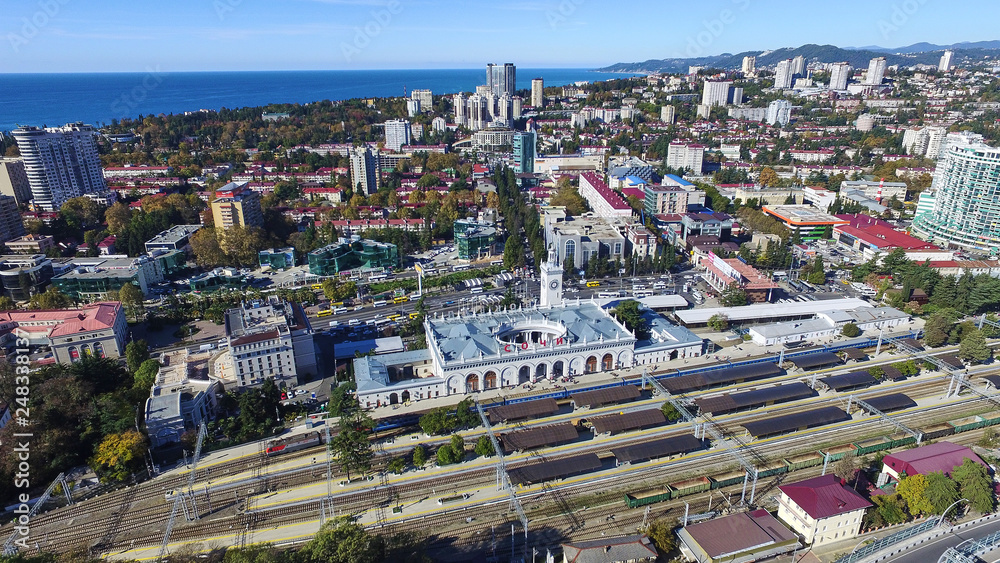 Sochi railway station building is in of city. Aerial view from platform. Sochi is city in Krasnodarskiy kray and Black Sea and summer beach resort