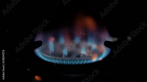 Pure energy in the form of a beautiful blue flame of natural gas on the stove photo