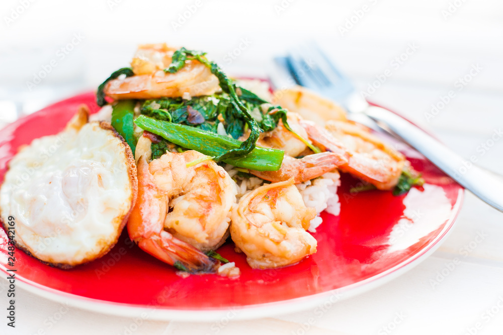 Thai holy basil, king prawns, fried egg with jasmine rice.