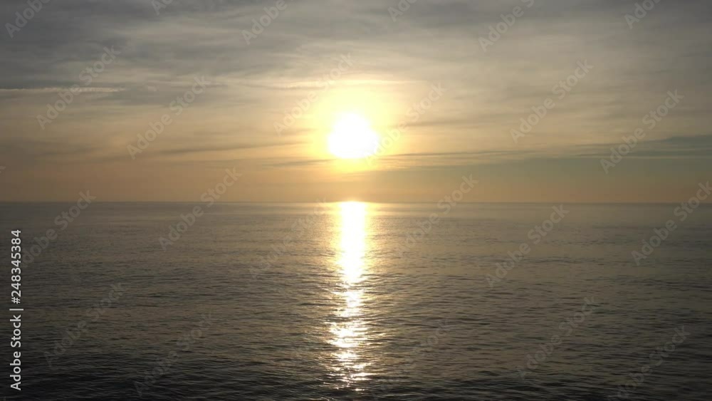 A beautiful sunrise in the calm sea A beautiful sunrise in the calm sea