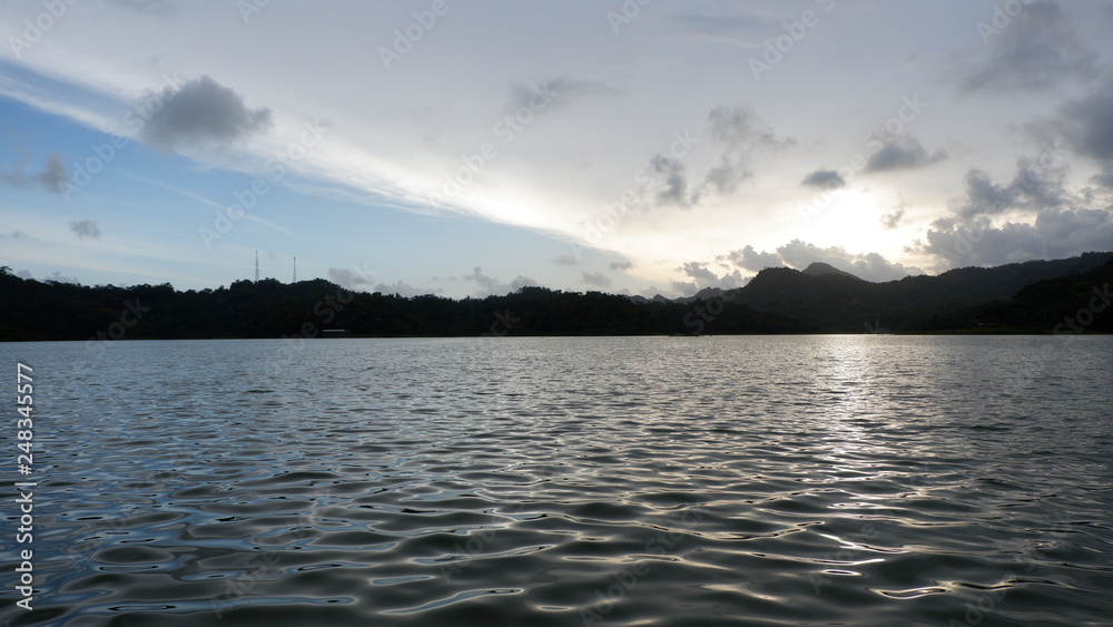 the view of the reddish blue sky at the lake at sunset