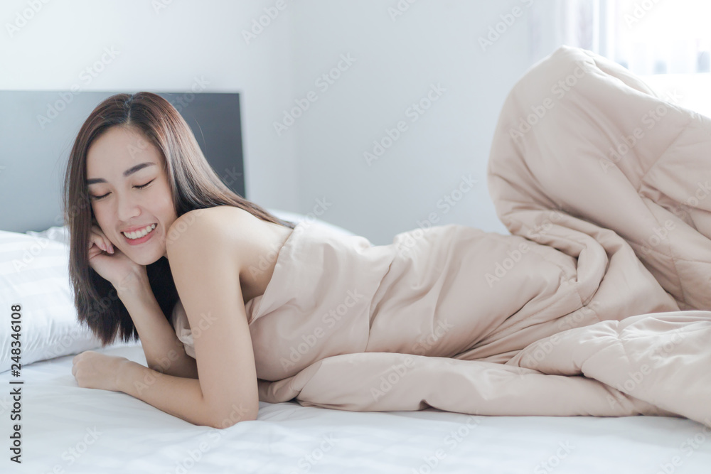 Sexy beautiful woman smile on bed