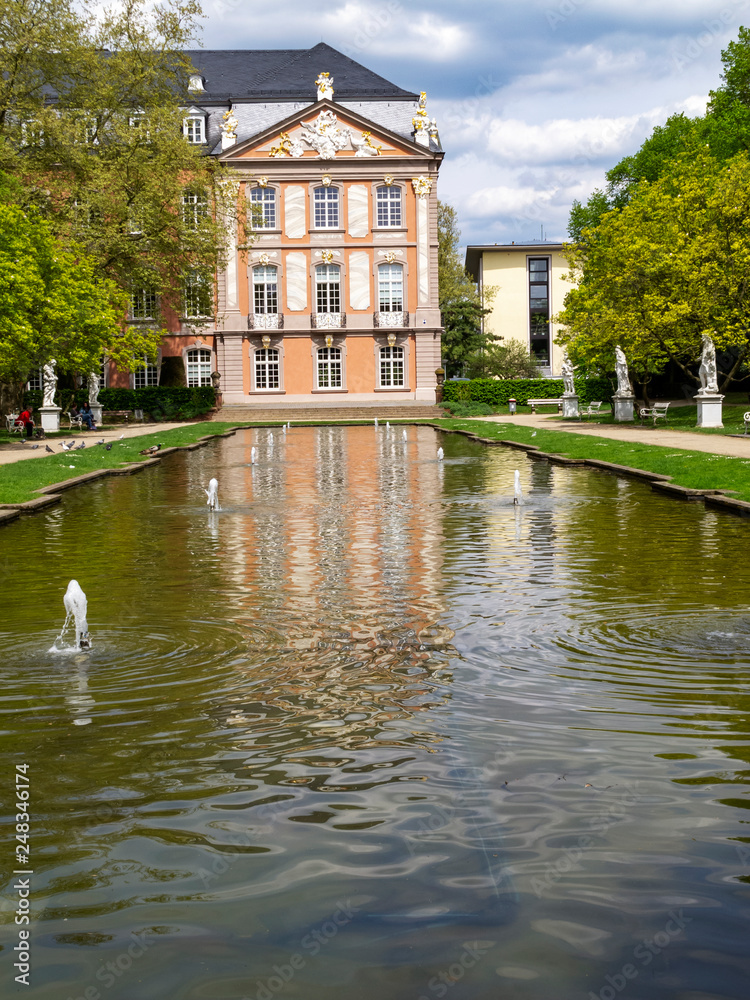 Electoral Palace with a pond in Trier, the oldest German city on a sunny April day