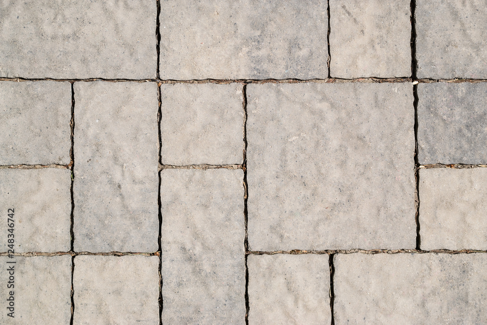 Naklejka premium stone road. the texture of the stones. stone background. the design of the laying of cobblestones