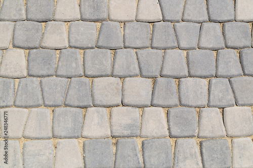 stone road. the texture of the stones. stone background. the design of the laying of cobblestones