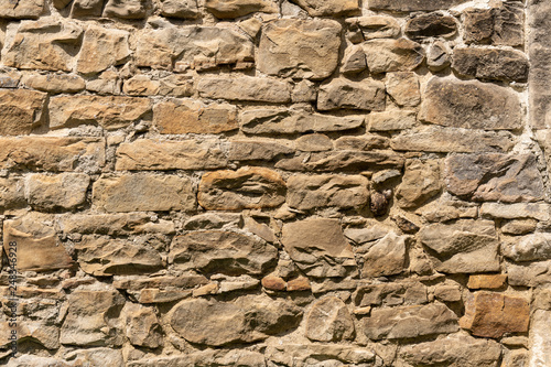 Medieval Stone Wall Texture. Old brick and stone wall with thick grout and very rough, irregular surface.