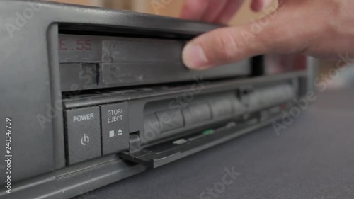 Inserting a VHS Tape into a VCR Player. Sound included. Flat Picture Profile