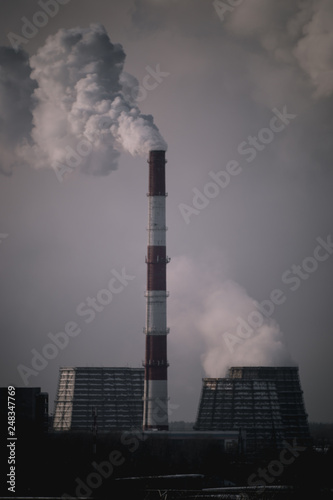 thick smoke comes from the pipe of a thermal power station