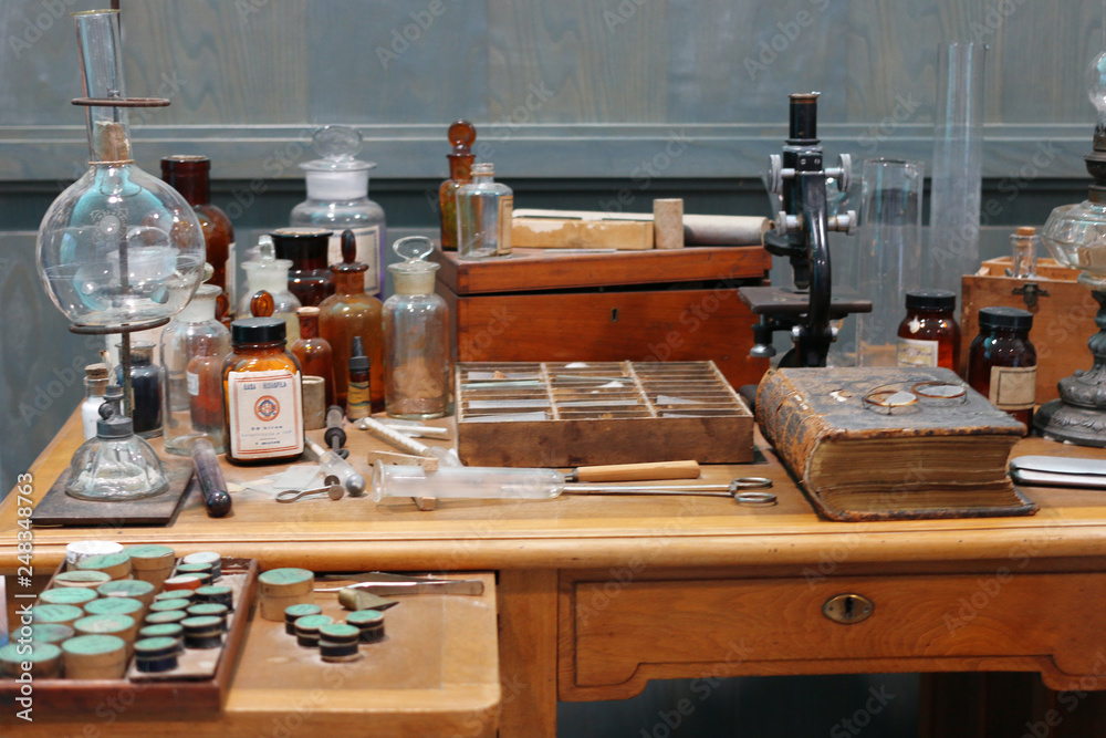 Old science lab with chemical reagents and burner Stock Photo Adobe Stock