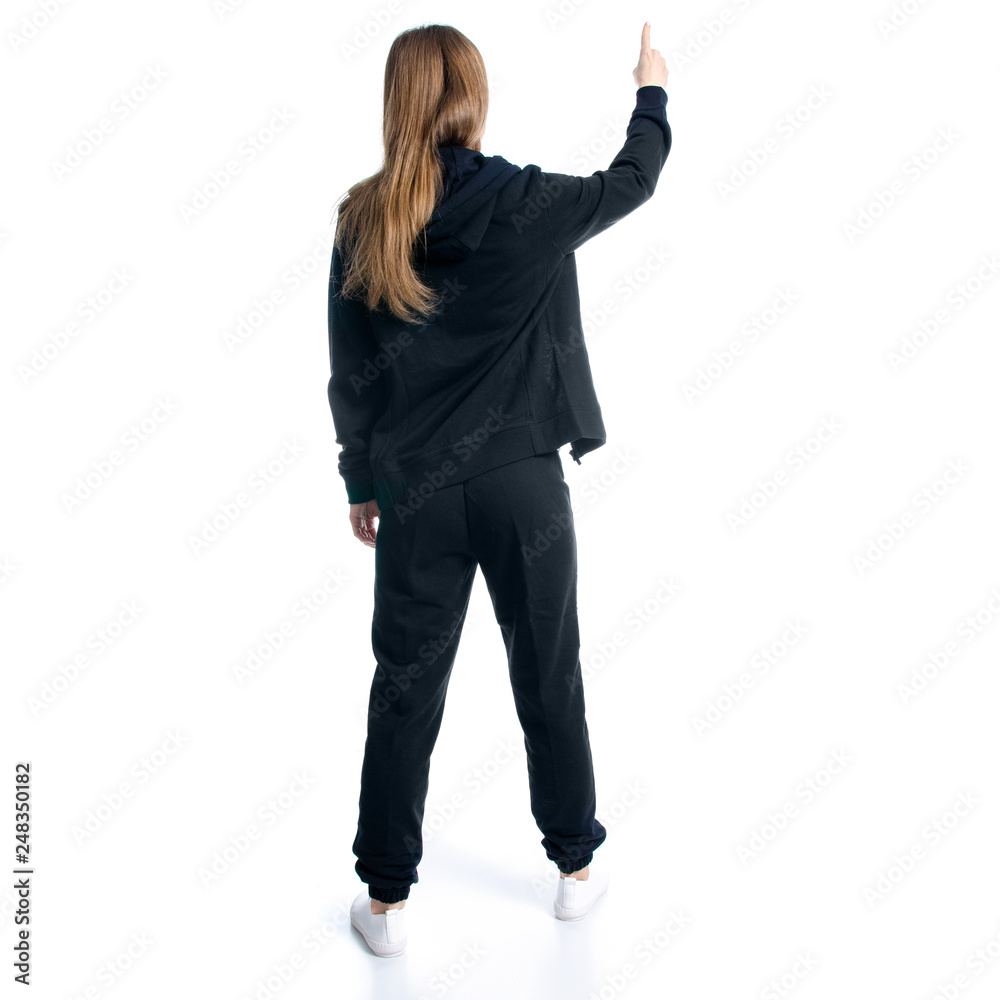 Woman in black tracksuit hood showing on white background isolation, back view Woman in black tracksuit hood showing on white background isolation, back view