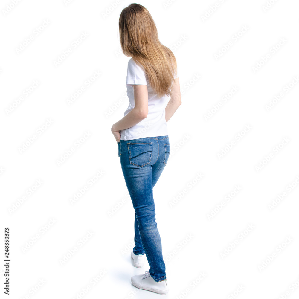 Woman in jeans and white t-shirt standing on white background isolation, back view Woman in jeans and white t-shirt standing on white background isolation, back view