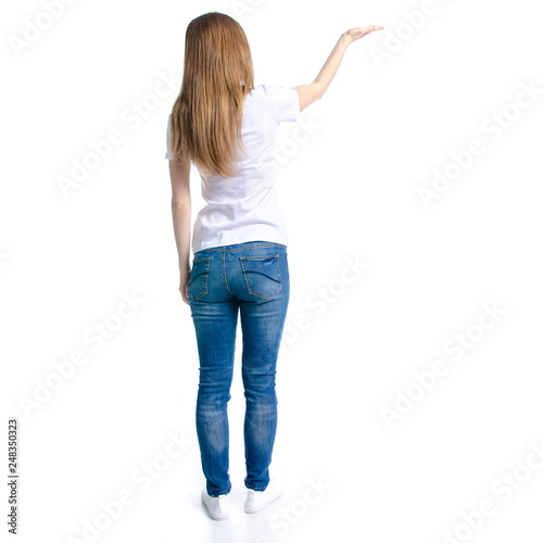 Woman in jeans and white t-shirt showing on white background isolation, back view