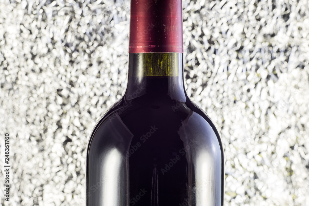 Bottle of wine close up on gray background Bottle of wine close up on gray background