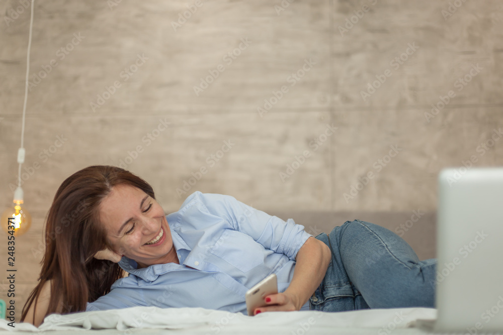 Beautiful mature woman using mobile phone Beautiful mature woman using mobile phone