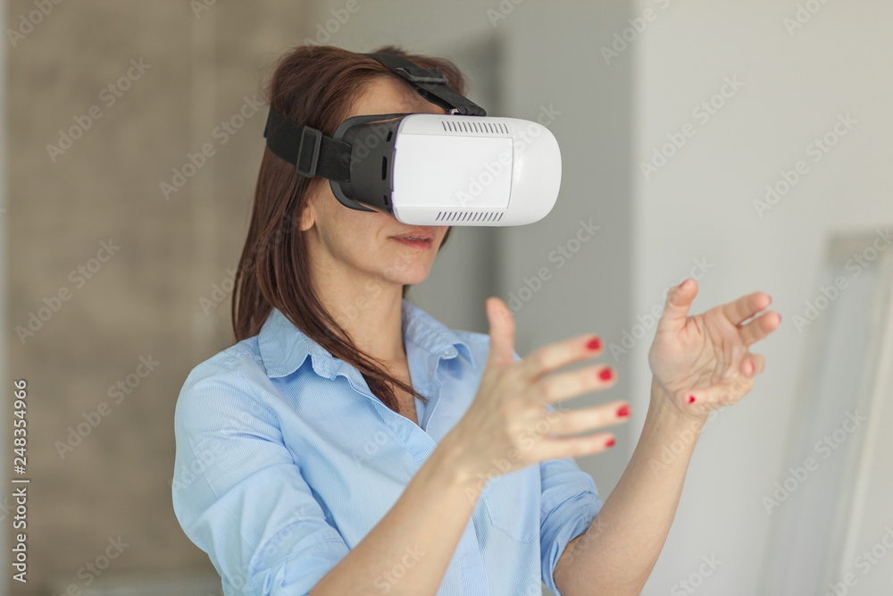 The woman with glasses of virtual reality. Future technology concept. Modern imaging technology. The woman with glasses of virtual reality. Future technology concept. Modern imaging technology.
