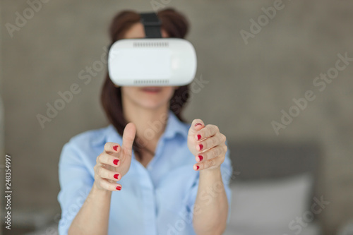 The woman with glasses of virtual reality. Future technology concept. Modern imaging technology.