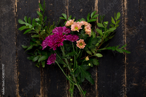 Flower business - a bouquet on a wooden background