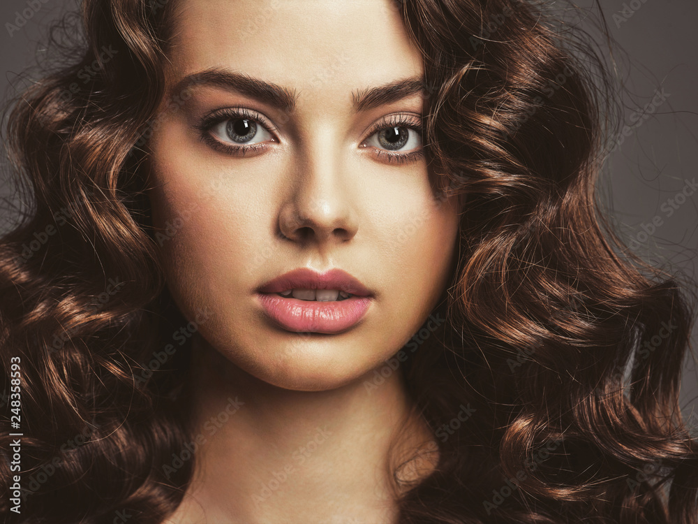 Fototapeta premium Closeup face of a beautiful woman with a smoky eye makeup