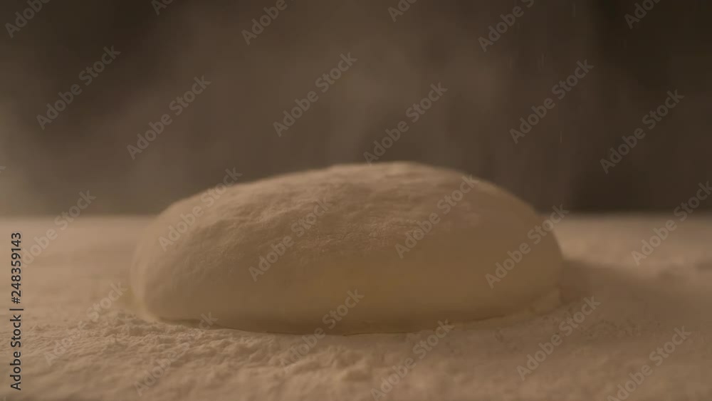 Dough is falling on board filled with Flour slow motion cooking video Dough is falling on board filled with Flour slow motion cooking video