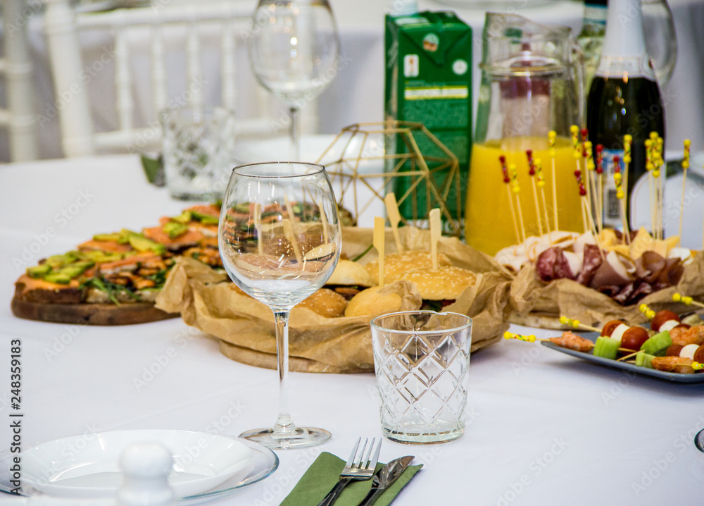 served table with food, drinks and appliances served table with food, drinks and appliances