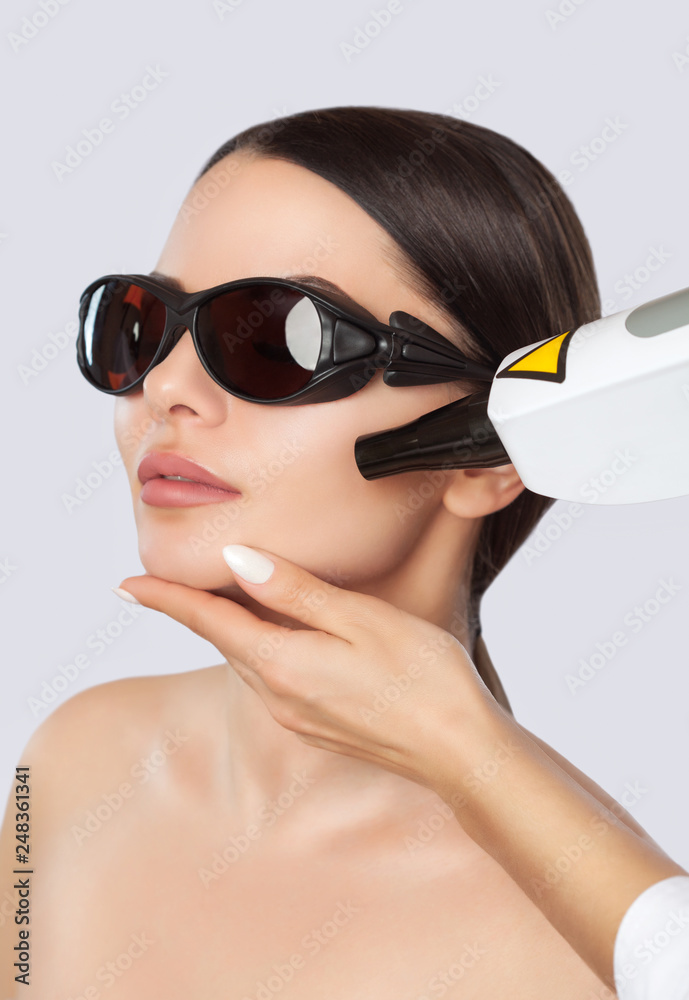 Carbon face peeling procedure in a beauty salon. Hardware cosmetology treatment. Carbon face peeling procedure in a beauty salon. Hardware cosmetology treatment.