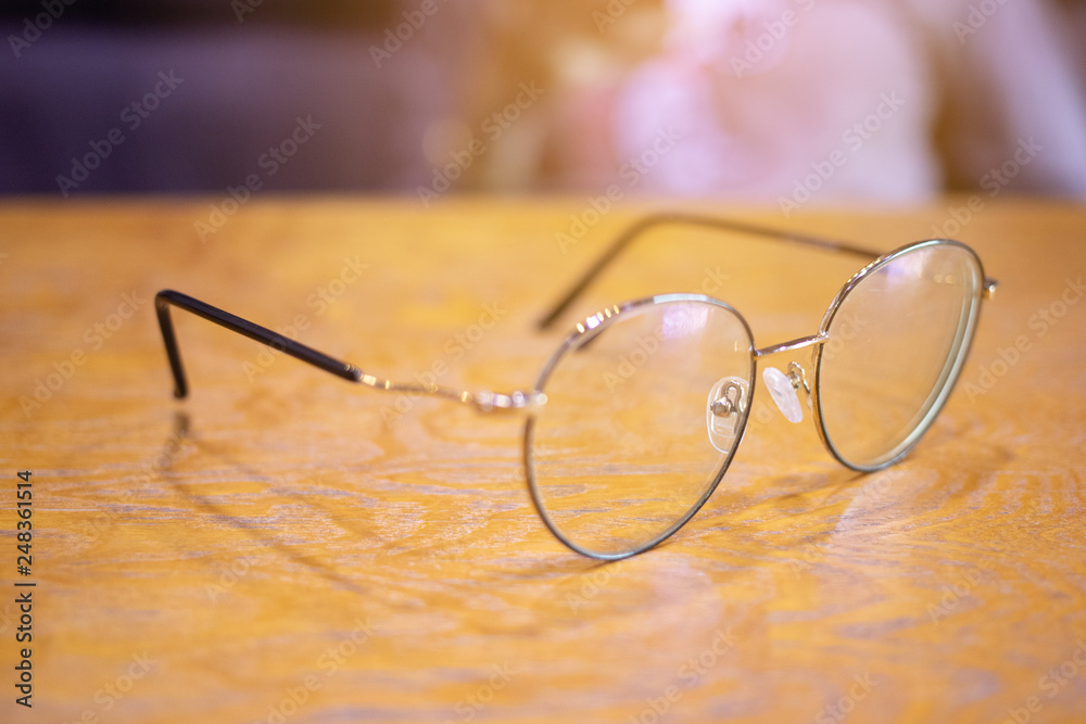 Eyeglasses on wooden table