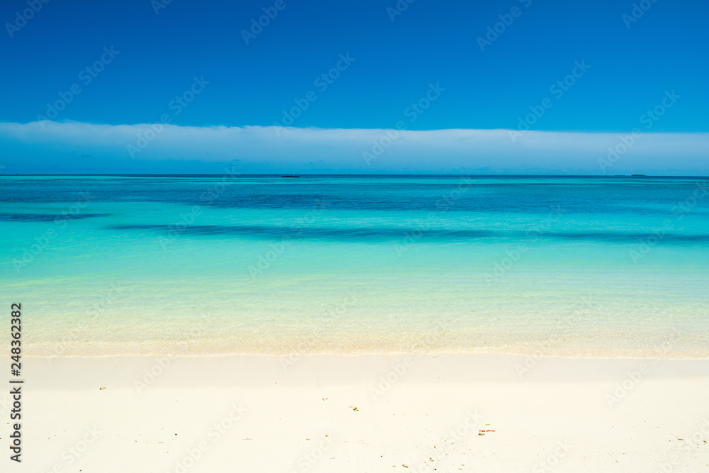 Beautiful landscape of clear turquoise Indian ocean, Maldives islands