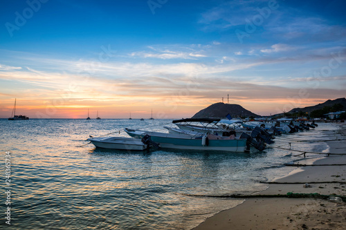 Boats on the shoreline of a Beach at Los Roques during the Sunset, Beautiful Venezuela