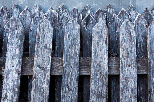 old broken wooden fence. textured grey wooden planks