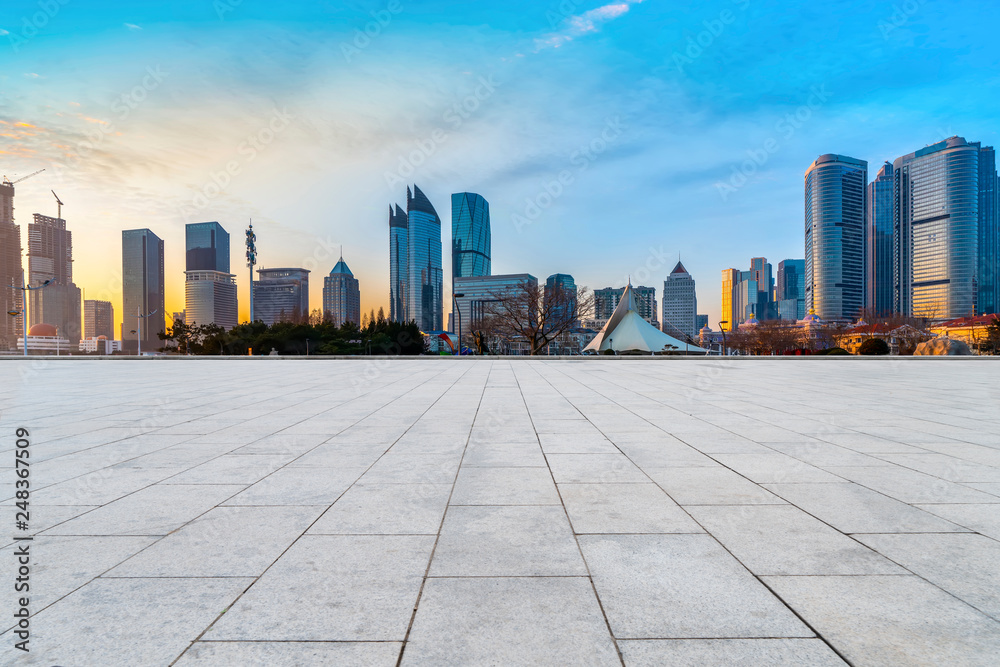 Empty Plaza Floor Bricks and the Skyline of Modern Urban Architecture in Qingdao..