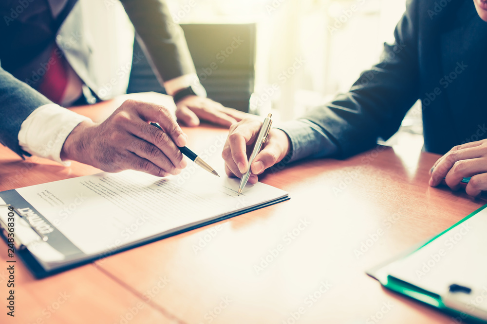 © amnaj - Businessman signing a contract partner. Contract trading house. House for rent. © amnaj - Businessman signing a contract partner. Contract trading house. House for rent.