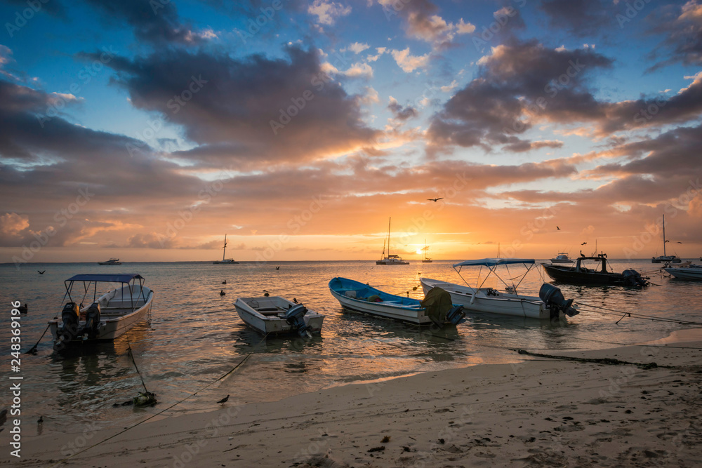 Boats on the shoreline of a Beach at Los Roques during the Sunset, Beautiful Venezuela