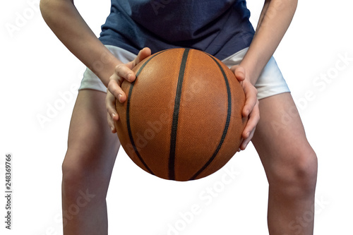 Basketball ball in two hands of a teenager. Close-up. Isolate on white background.