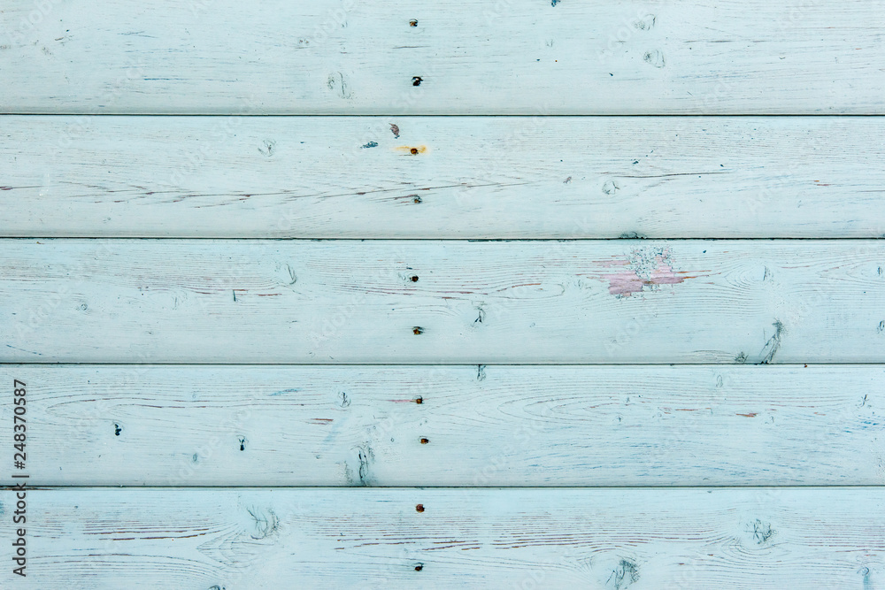 Section of white wood panelling from a seaside beach hut. Perfect as a background for Summer Holiday or seaside themes.