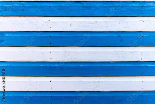 Section of blue and white wood panelling from a seaside beach hut. Perfect as a background for Summer Holiday or seaside themes.