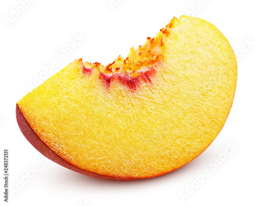 Slice of ripe peach fruit isolated on white background. Peach slice with clipping path. Full depth of field.